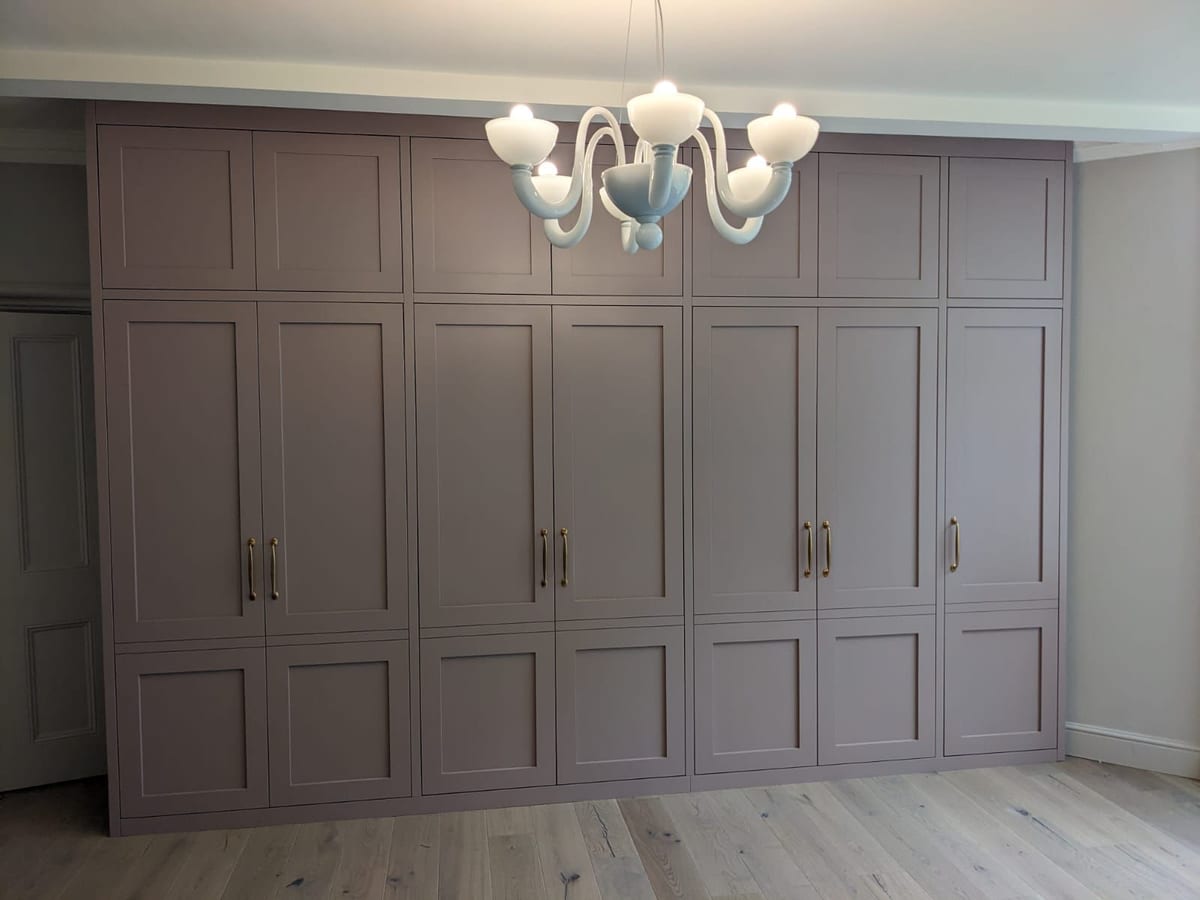 Bespoke fitted bedroom wardrobes with shaker doors and integrated storage