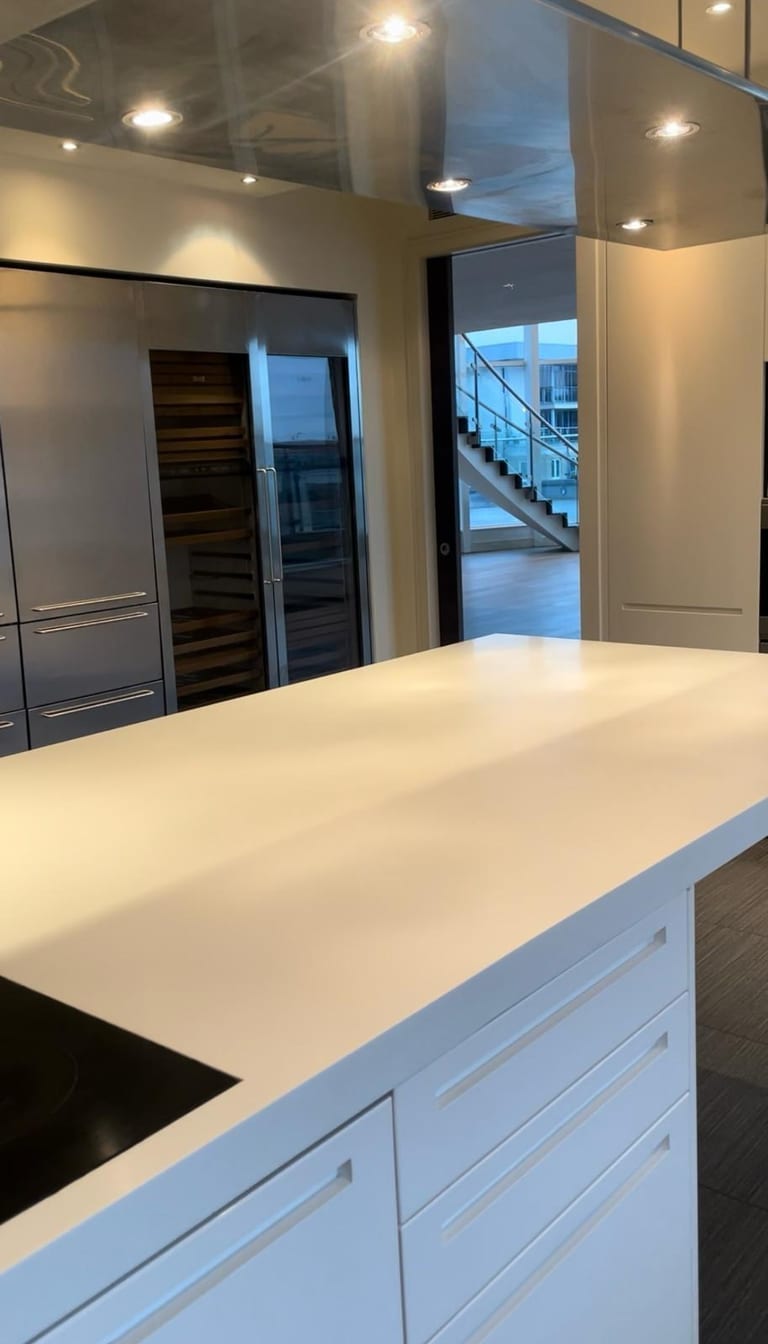 Completed contemporary kitchen renovation with handleless cabinetry and integrated lighting